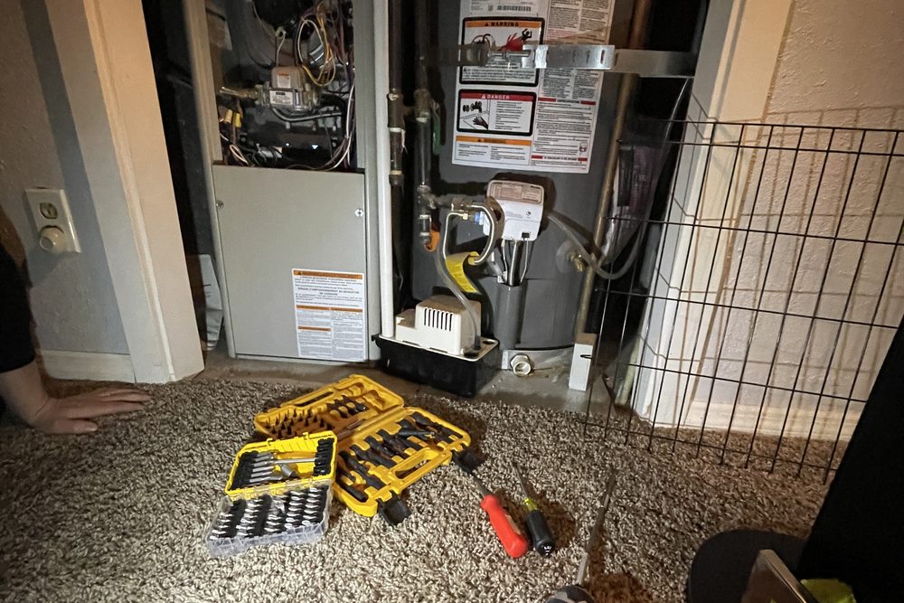 Furnace and water heater in a hallway closet